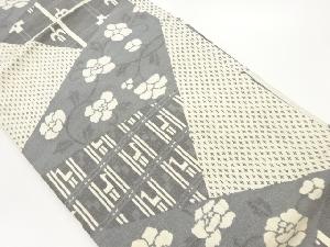 手織り紬切り嵌め風花唐草に十字絣・抽象動物模様名古屋帯